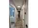 Hallway with neutral paint that provides access to bedrooms and bathrooms at 9918 Turf Way # 5, Orlando, FL 32837