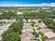 Aerial view capturing a single-Gathering home with a screened-in pool, in a community with mature trees and nearby amenities at 12641 Arley Dr, Windermere, FL 34786