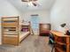 This bedroom is equipped with a wooden bunk bed, dresser and desk, ideal for a room at 12641 Arley Dr, Windermere, FL 34786