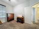 This bedroom features a wooden dresser and desk near a window, perfect for a room or guest bedroom at 12641 Arley Dr, Windermere, FL 34786