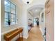 Inviting entryway featuring tile flooring, arched doorways, and a view of the living spaces at 12641 Arley Dr, Windermere, FL 34786