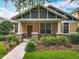 Charming home with a covered front porch, well-maintained landscaping, and a welcoming entrance at 12641 Arley Dr, Windermere, FL 34786