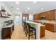Bright kitchen features tile flooring, stainless steel appliances, and a breakfast bar with seating at 12641 Arley Dr, Windermere, FL 34786