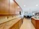 Spacious kitchen with wooden cabinets, modern appliances, and an open layout to the living area at 12641 Arley Dr, Windermere, FL 34786