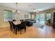 Relax in the living room with views of the pool outside through sliding glass doors and large windows at 12641 Arley Dr, Windermere, FL 34786