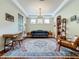 Comfortable living room with a stylish rug, modern furniture, and bright natural light at 12641 Arley Dr, Windermere, FL 34786