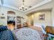Open living area with a view into the kitchen, featuring a patterned rug and stylish decor at 12641 Arley Dr, Windermere, FL 34786