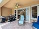 Covered patio with furniture and a grill, creating a relaxing outdoor living area at 12641 Arley Dr, Windermere, FL 34786