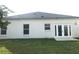 The home's rear exterior has windows and glass doors opening to the backyard at 10513 Leader Ln, Orlando, FL 32825