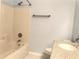 Cozy bathroom features a tiled shower/tub combination and a vanity with granite countertop at 10513 Leader Ln, Orlando, FL 32825