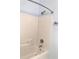 Shower/tub combination featuring tiled enclosure and a vanity with granite countertop at 10513 Leader Ln, Orlando, FL 32825