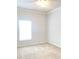 Bedroom featuring neutral carpet, window bringing natural light, and a ceiling fan at 10513 Leader Ln, Orlando, FL 32825