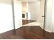 Entryway with hardwood floors and a view into the living room with a fireplace at 10513 Leader Ln, Orlando, FL 32825