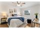 Bright bedroom featuring a ceiling fan, modern decor, and a large window at 108 Devon Ct, Longwood, FL 32779