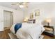 Inviting bedroom with a soft color palette and wood laminate flooring at 108 Devon Ct, Longwood, FL 32779