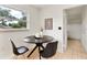Cozy breakfast nook with modern black table set, perfect for morning coffee or casual dining at 108 Devon Ct, Longwood, FL 32779