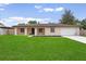 Charming single-story home with a well-manicured lawn and attached garage, perfect curb appeal at 108 Devon Ct, Longwood, FL 32779