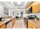 Well-equipped kitchen with stainless steel appliances, granite countertops, and ample cabinet space at 108 Devon Ct, Longwood, FL 32779