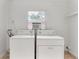 Functional laundry room with washer, dryer, and window for natural light at 108 Devon Ct, Longwood, FL 32779