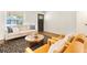 Inviting living room with neutral sofa, wood flooring, and a round coffee table, great for relaxing or entertaining at 108 Devon Ct, Longwood, FL 32779