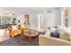 Bright living room featuring modern furniture, wood floors, and stylish decor, with plenty of natural light at 108 Devon Ct, Longwood, FL 32779