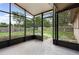 View of a screened patio overlooking the backyard at 108 Devon Ct, Longwood, FL 32779
