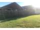Well-maintained lawn area in backyard, enclosed by a wooden fence for privacy at 10969 Norcross Cir, Orlando, FL 32825