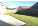 Backyard featuring a concrete patio and a wooden fence, enhancing privacy and outdoor enjoyment at 10969 Norcross Cir, Orlando, FL 32825