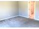 Bedroom featuring neutral paint, carpeted floor, and bath access at 10969 Norcross Cir, Orlando, FL 32825