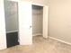 Bedroom featuring carpeted floors and access to closet space at 10969 Norcross Cir, Orlando, FL 32825