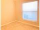 Bedroom with neutral walls, carpet, and natural light through a window at 10969 Norcross Cir, Orlando, FL 32825