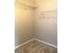 Empty walk-in closet featuring carpet and wire shelving for efficient storage solutions at 10969 Norcross Cir, Orlando, FL 32825