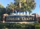 Elegant community sign for Andover Lakes I, surrounded by lush landscaping and mature palm trees at 10969 Norcross Cir, Orlando, FL 32825