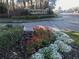 Well-maintained entrance to Andover Lakes community with colorful flowers and manicured greenery at 10969 Norcross Cir, Orlando, FL 32825
