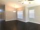 Living room featuring wood floors and bright, natural light at 10969 Norcross Cir, Orlando, FL 32825