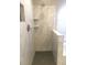 Updated shower with marble style tile surround and built-in shelves at 10969 Norcross Cir, Orlando, FL 32825