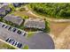 Aerial view of complex, parking, and landscaping at 110 Claire Ln, Davenport, FL 33837