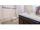 Well-lit bathroom featuring vanity and a shower-tub combination at 110 Claire Ln, Davenport, FL 33837