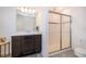 Bathroom featuring a vanity with mirror and tiled glass door shower at 110 Claire Ln, Davenport, FL 33837