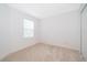 Empty bedroom featuring carpet flooring, neutral walls, and a window at 110 Claire Ln, Davenport, FL 33837