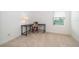 Office/bedroom with carpet flooring, a desk, and a window offering natural light at 110 Claire Ln, Davenport, FL 33837
