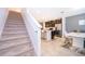 Bright kitchen featuring stainless steel appliances, a breakfast bar, and an adjacent dining area at 110 Claire Ln, Davenport, FL 33837