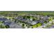 An aerial view of a suburban neighborhood with well-maintained homes and lush green lawns surrounding a pond at 1113 Fieldstone Cir, Oviedo, FL 32765