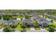 Aerial view of a residential neighborhood showcasing well-maintained homes, lush landscaping, and community lake at 1113 Fieldstone Cir, Oviedo, FL 32765