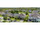 An aerial view of a lovely suburban neighborhood featuring well-maintained homes surrounding a peaceful pond at 1113 Fieldstone Cir, Oviedo, FL 32765