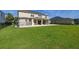 Spacious backyard with well-maintained lawn and patio area, perfect for outdoor activities at 1113 Fieldstone Cir, Oviedo, FL 32765