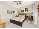 Tastefully decorated bedroom with wall décor, a ceiling fan, a black bedframe, and gray carpeting at 1113 Fieldstone Cir, Oviedo, FL 32765