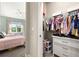 Bedroom with closet, dresser, ceiling fan, and natural light at 1113 Fieldstone Cir, Oviedo, FL 32765