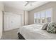 Bedroom with a spacious closet and plantation shutters for natural light control and added privacy at 1113 Fieldstone Cir, Oviedo, FL 32765