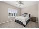 Cozy bedroom featuring a ceiling fan, a plush bed, shuttered windows, and a nightstand for convenient bedside storage at 1113 Fieldstone Cir, Oviedo, FL 32765